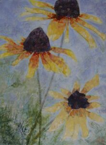 Three yellow coneflowers created in collage papers on a blue background with hints of greenery on the lower left. The background has texture and is painted, then lightly painted over with another color to produce great depth and interest.