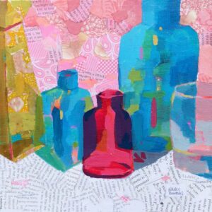 Blue, red and yellow clear glass vases painted in a row on a table created with book print. Pink patterned background reflects into the painted vases, which is imagination at play because the background was not patterned in real life : )